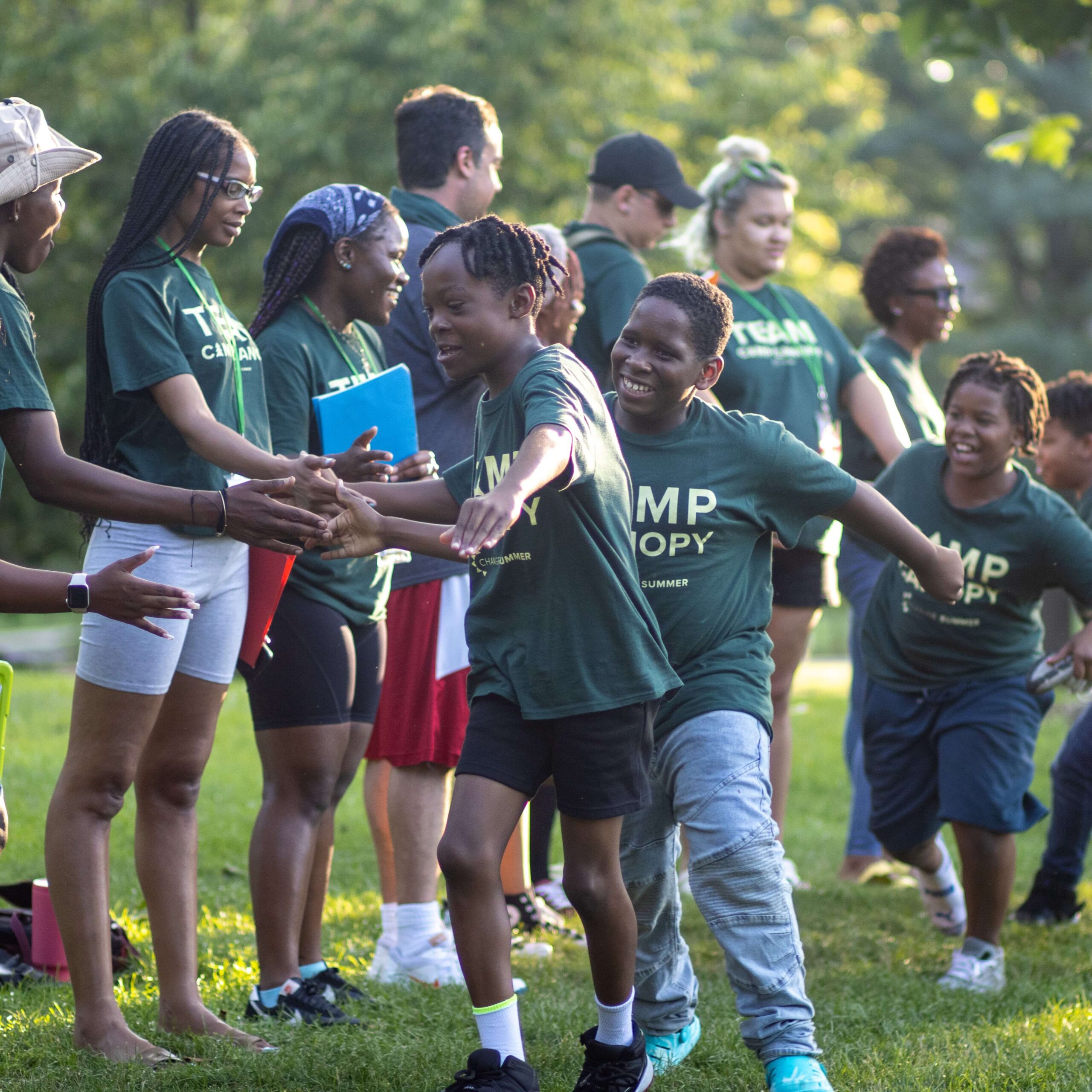 kids congratulate each other after playing a game