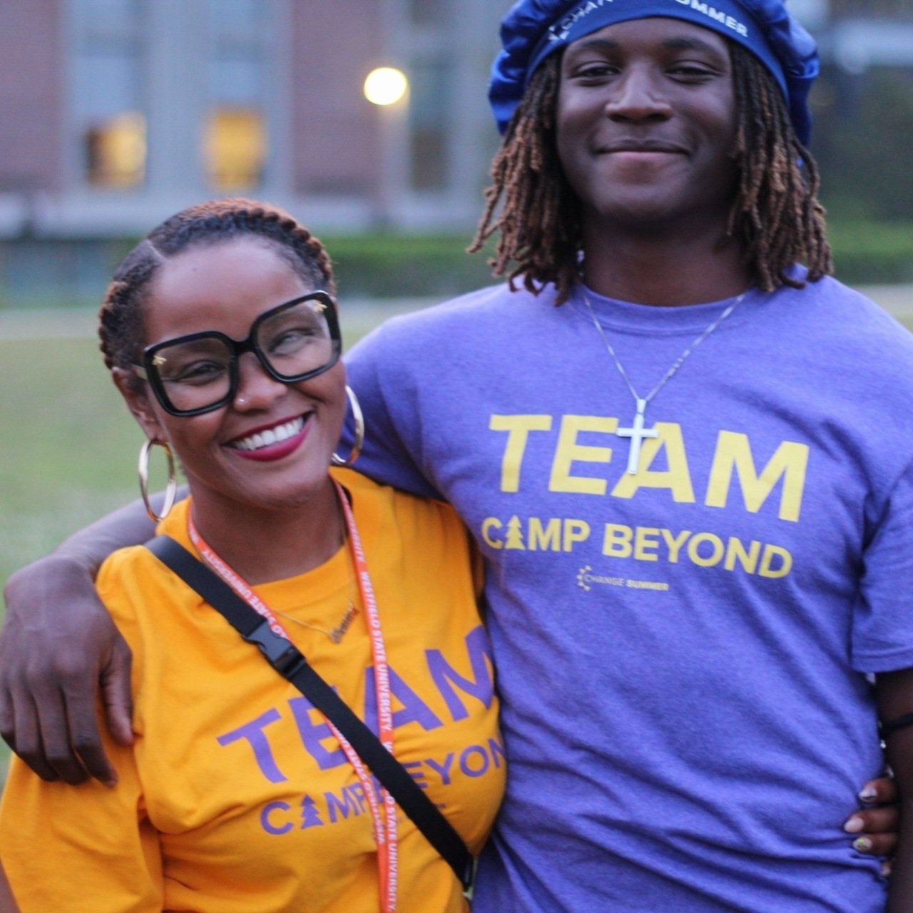 Daana Nelson smiles with a camper.