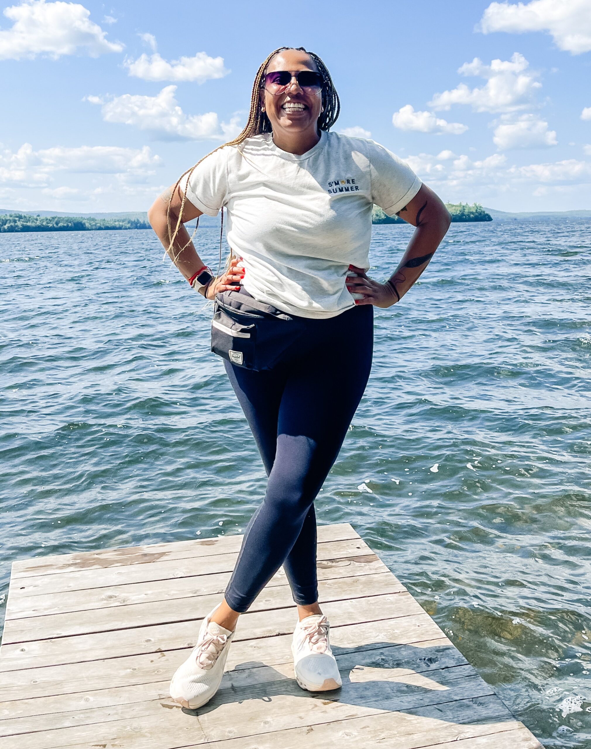 Briana poses by a body of water.